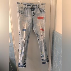 Motive denim Jeans patched with rips